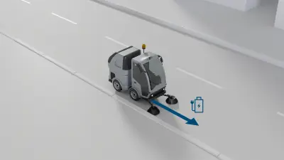 An electrically powered municipal vehicle driving on a road