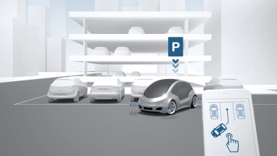 The remote park assist system automatically moves the car in and out of a selected parking space. 